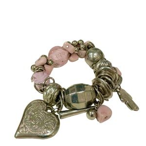Chunky silver tone and pink stretchy charm bracelet.